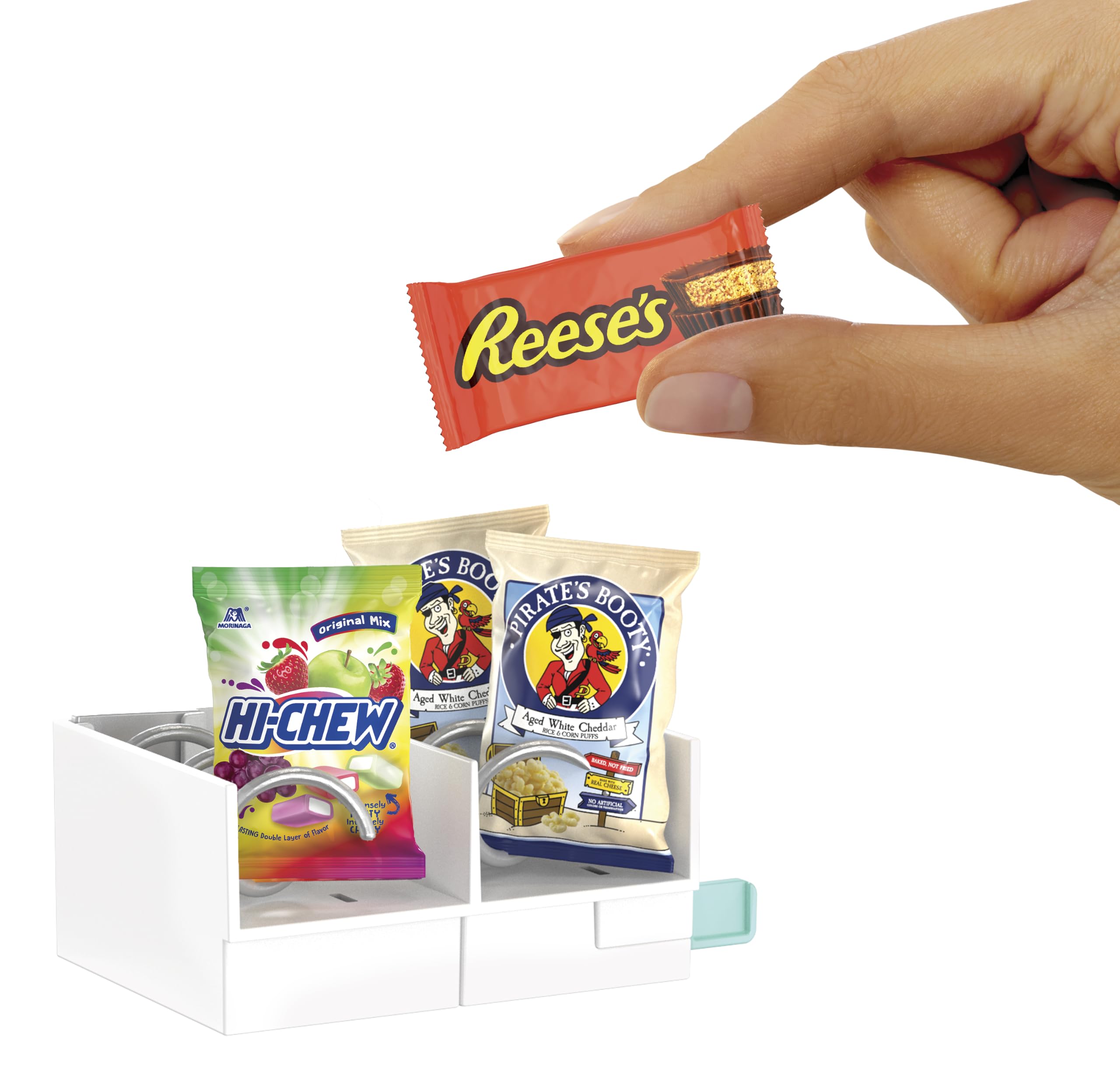 Mini credit card inserted and MGA's Miniverse vending dispensing a mini for hands-on play