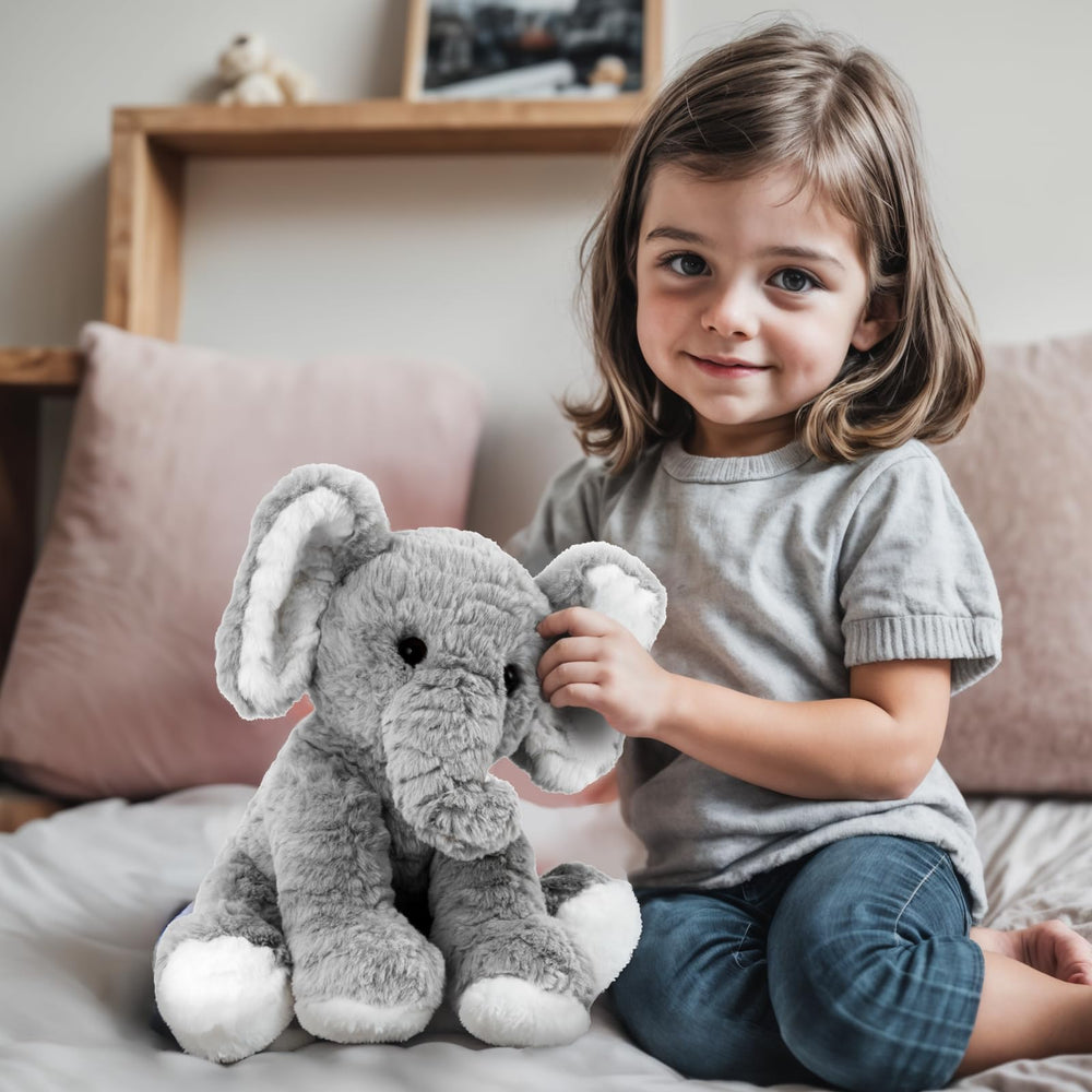 Mikee Fluffie elephant plush with long soft fur for gentle touch.