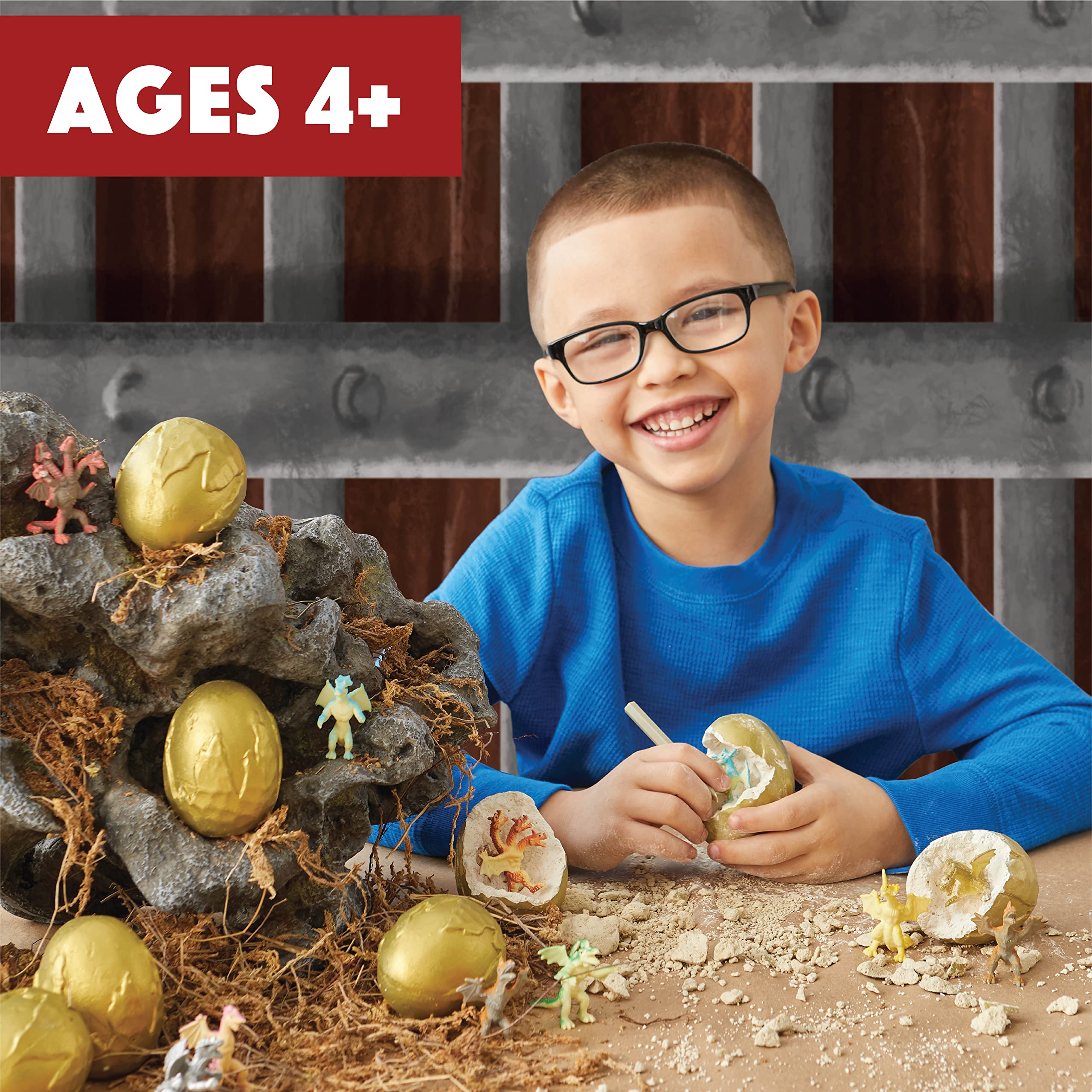 MindWare Dig It Up! Dragon Eggs chisels in hand for careful excavation.