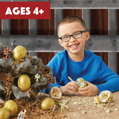 MindWare Dig It Up! Dragon Eggs chisels in hand for careful excavation.