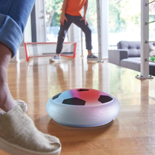 MindWare hover soccer ball charging via USB for extended indoor sessions