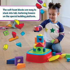 Child enjoys hands-on KaBlocks Blast play with blocks and launch action.
