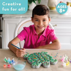 MindWare Turtle Stepping Stone Kit child painting stone during a craft session.