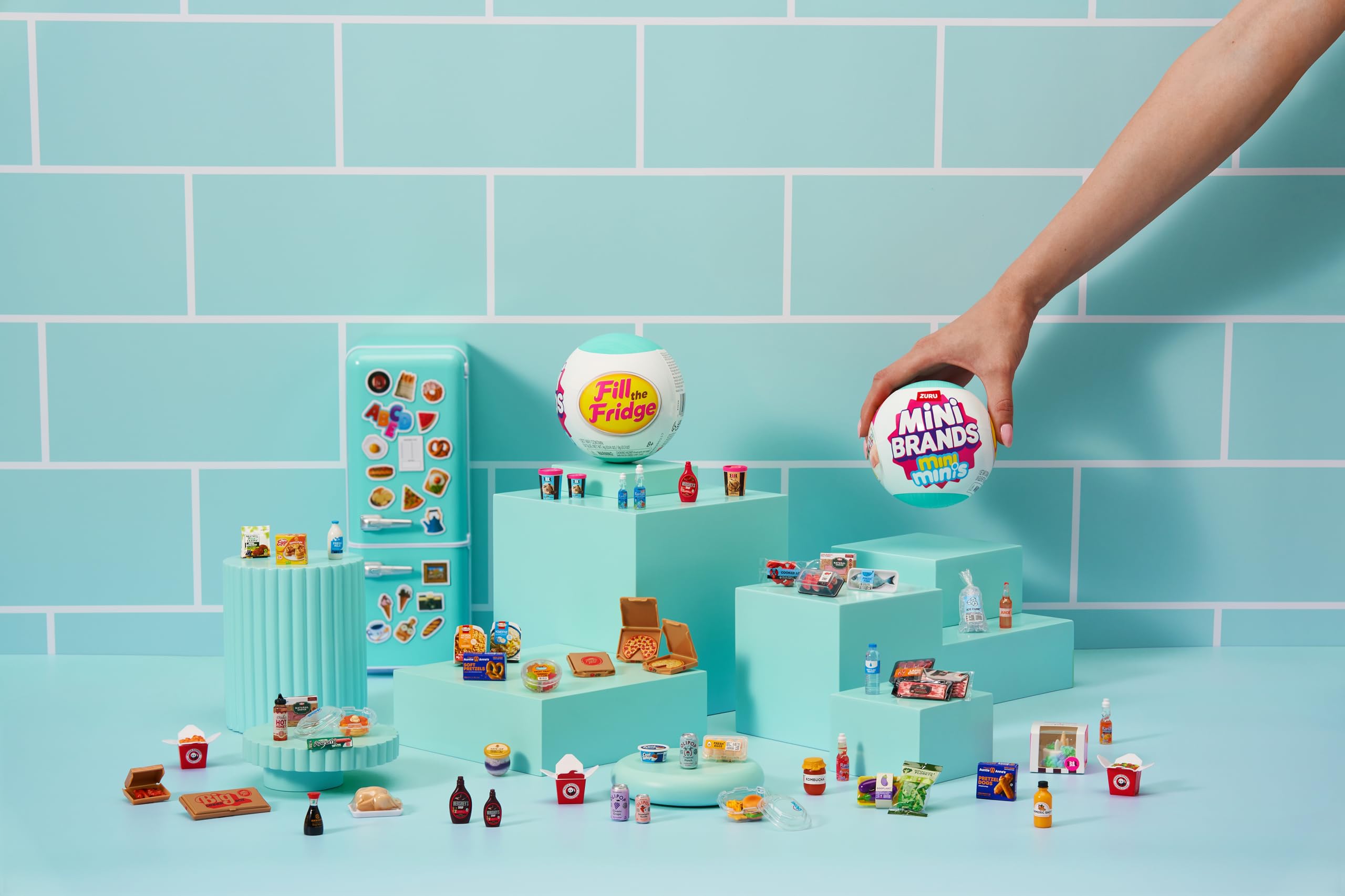 Mini Brands arranged on a miniature kitchen shelf for collectible display benefit