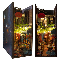 MINIALLEY Dreamy book nook kit front view with cozy LED lighting for shelf ambience.