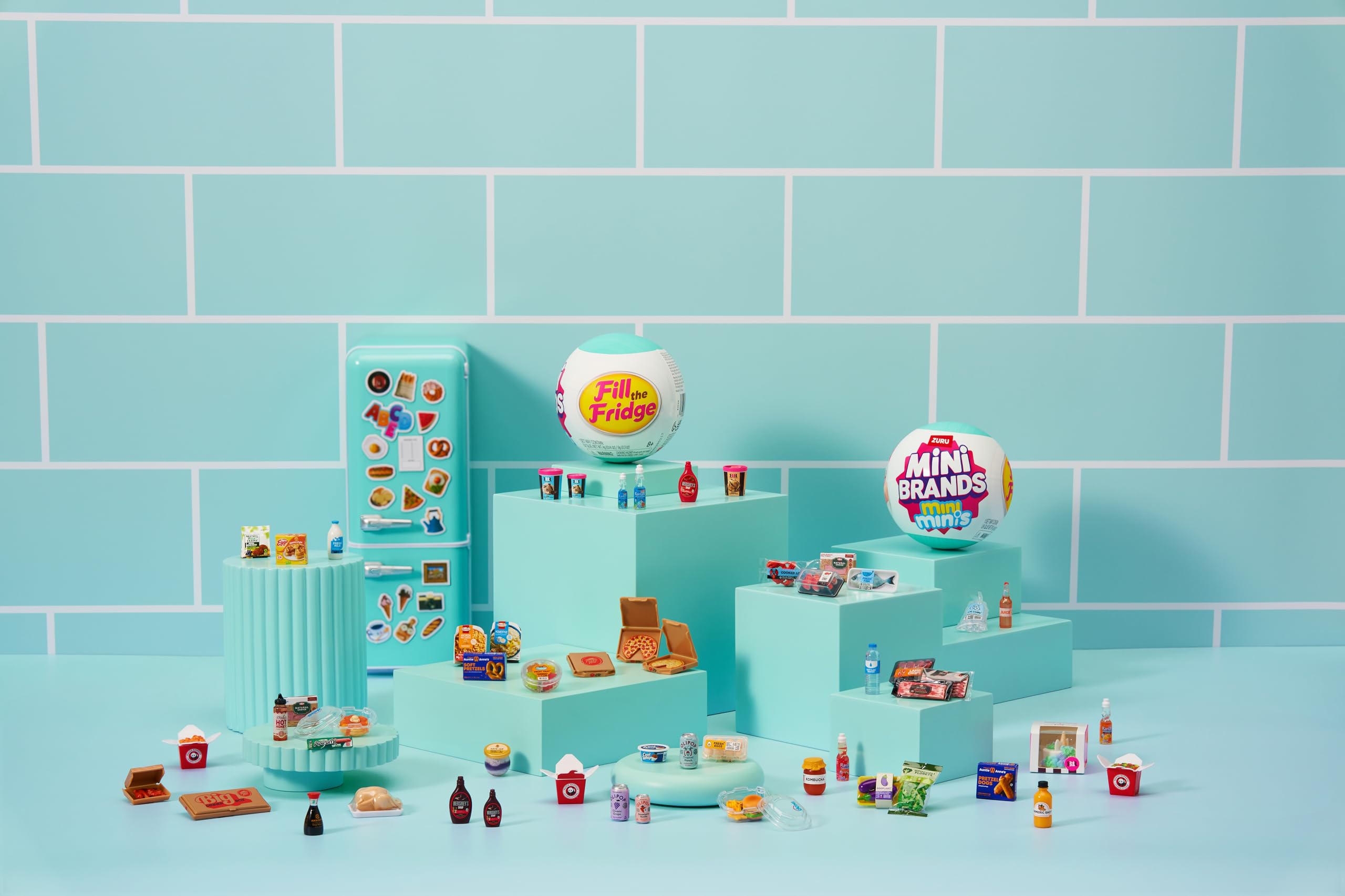 Close-up of magnets and tiny foods inside the Mini Brands fridge.