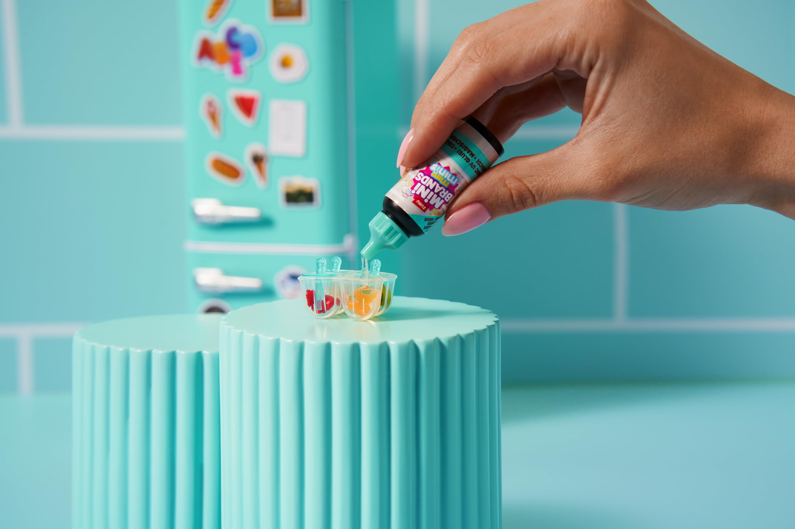 UV light inside the Mini Brands fridge highlighting tiny minis.