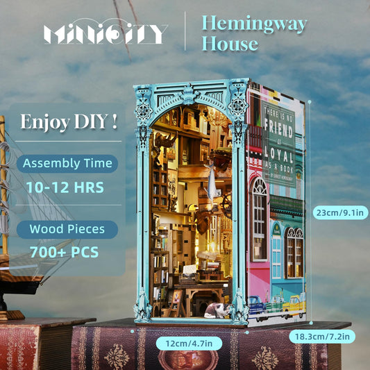 MiniCity book nook LED glow illuminating tiny library scene.