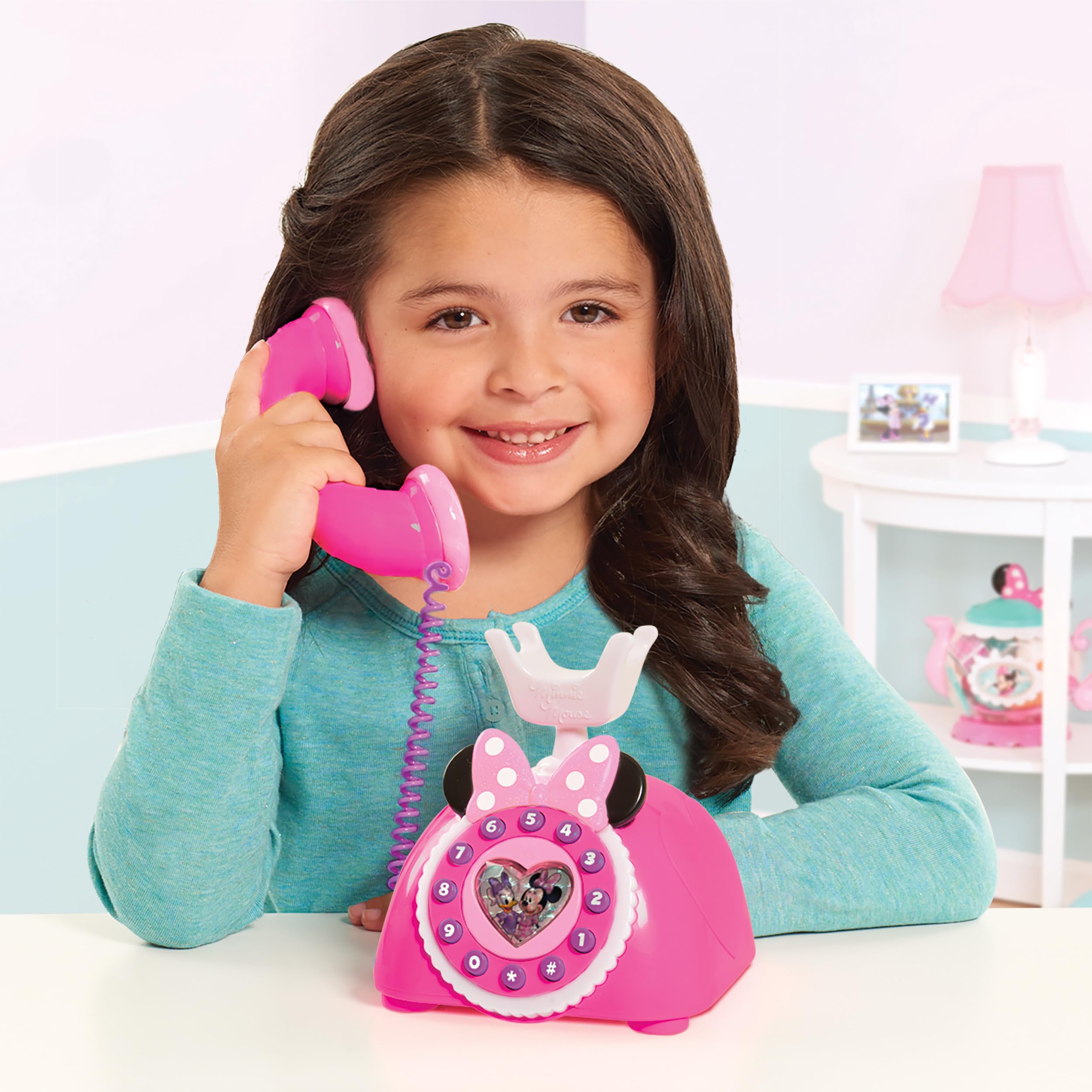 MINNIE's Happy Helpers rotary phone with phrases and sounds for interactive storytelling.