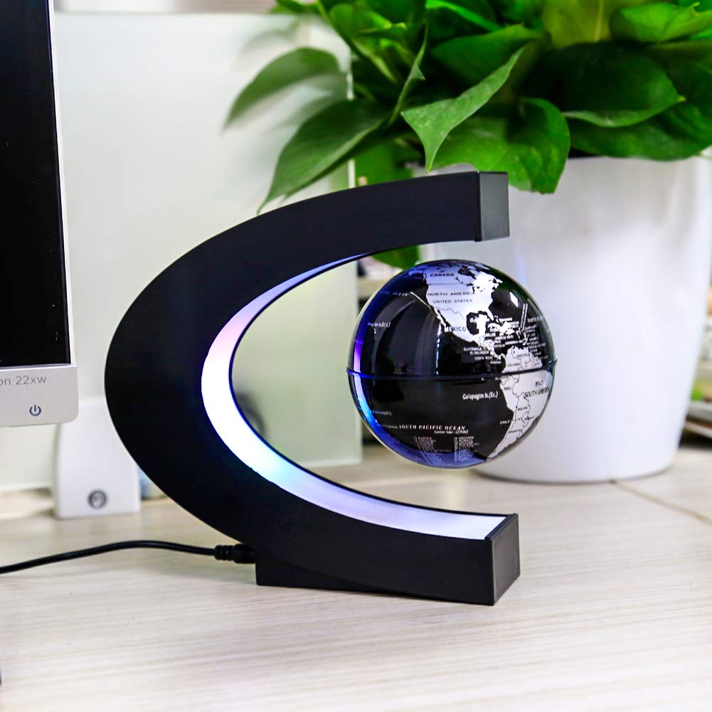 MOKOQI floating globe with LED frame provides ambient workspace lighting.