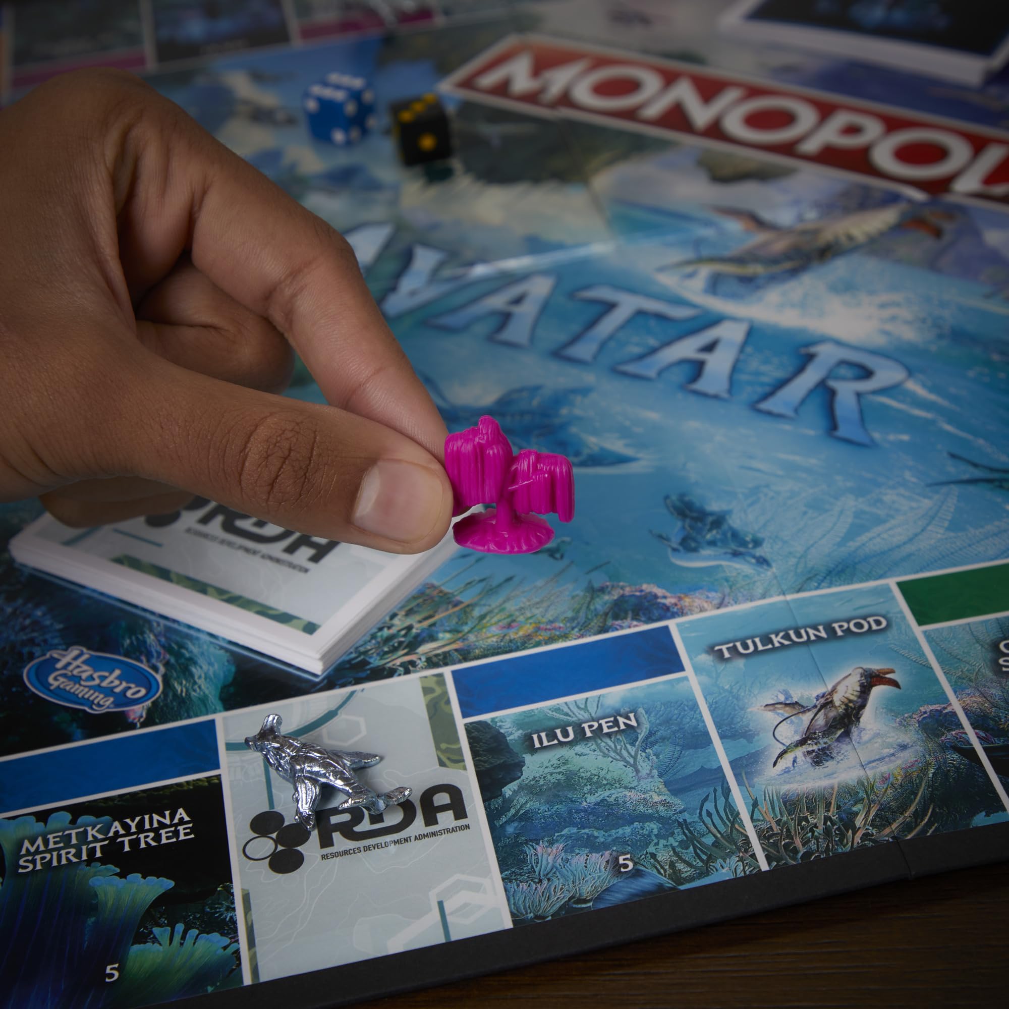 Monopoly Avatar Edition RDA Scorpion token on the board.