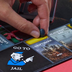 Players plan moves during a tabletop setup for strategy.