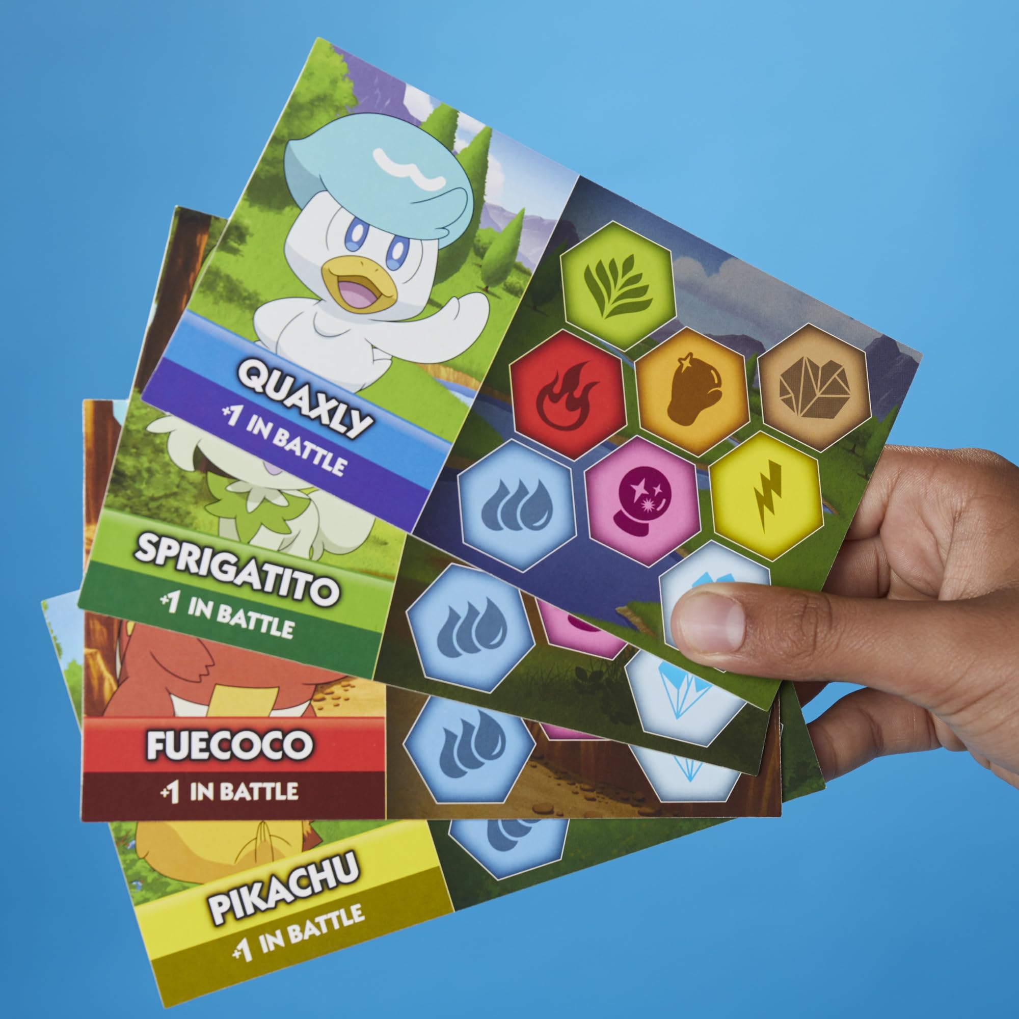 Monopoly Pokémon Edition battle and adventure cards in play.