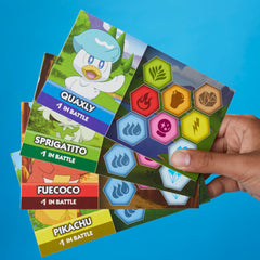 Monopoly Pokémon Edition battle and adventure cards in play.