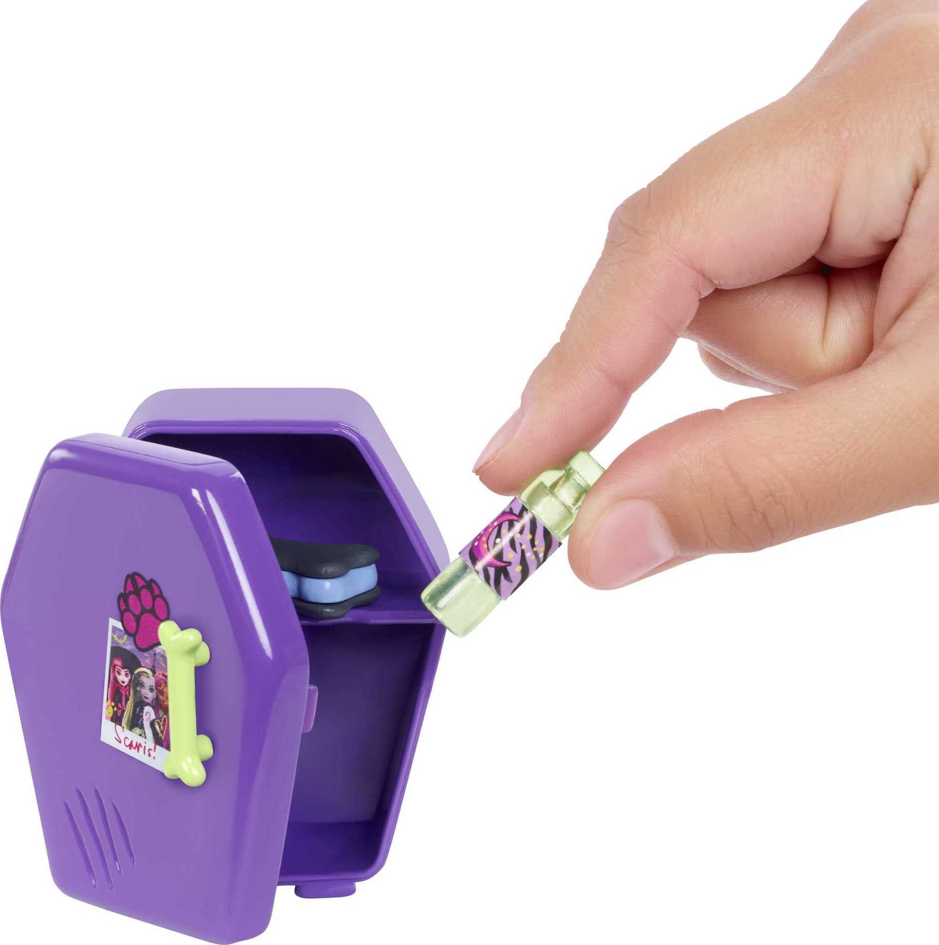 Monster High Clawdeen mini-fridge opens for pretend snacks.