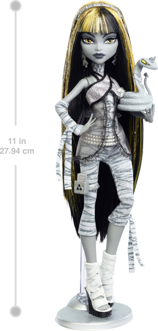 Cleo De Nile black-and-white doll with gold hair highlights for drama.
