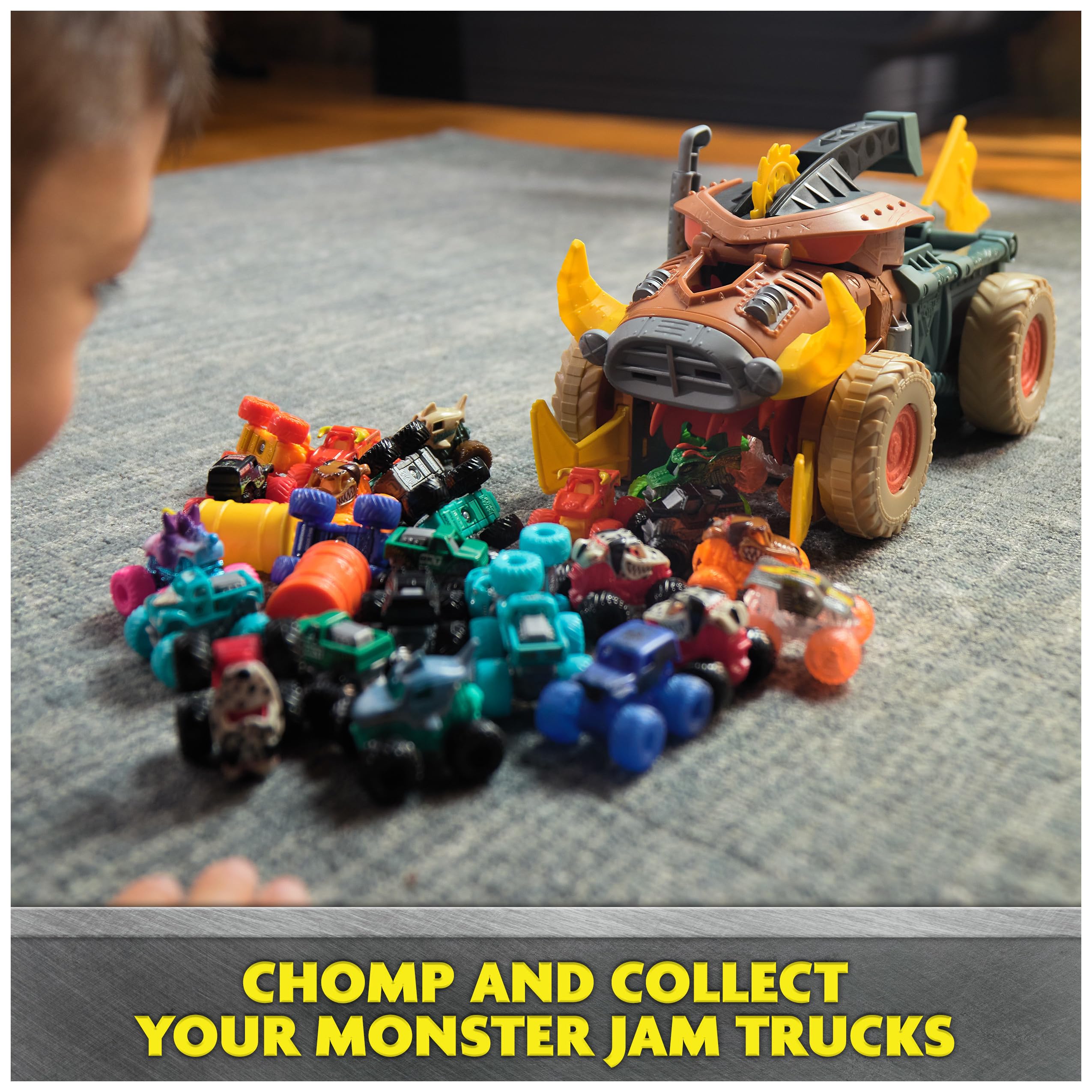 Monster Jam Mad Hog Chomper captures Mini Jams trucks for cleanup.