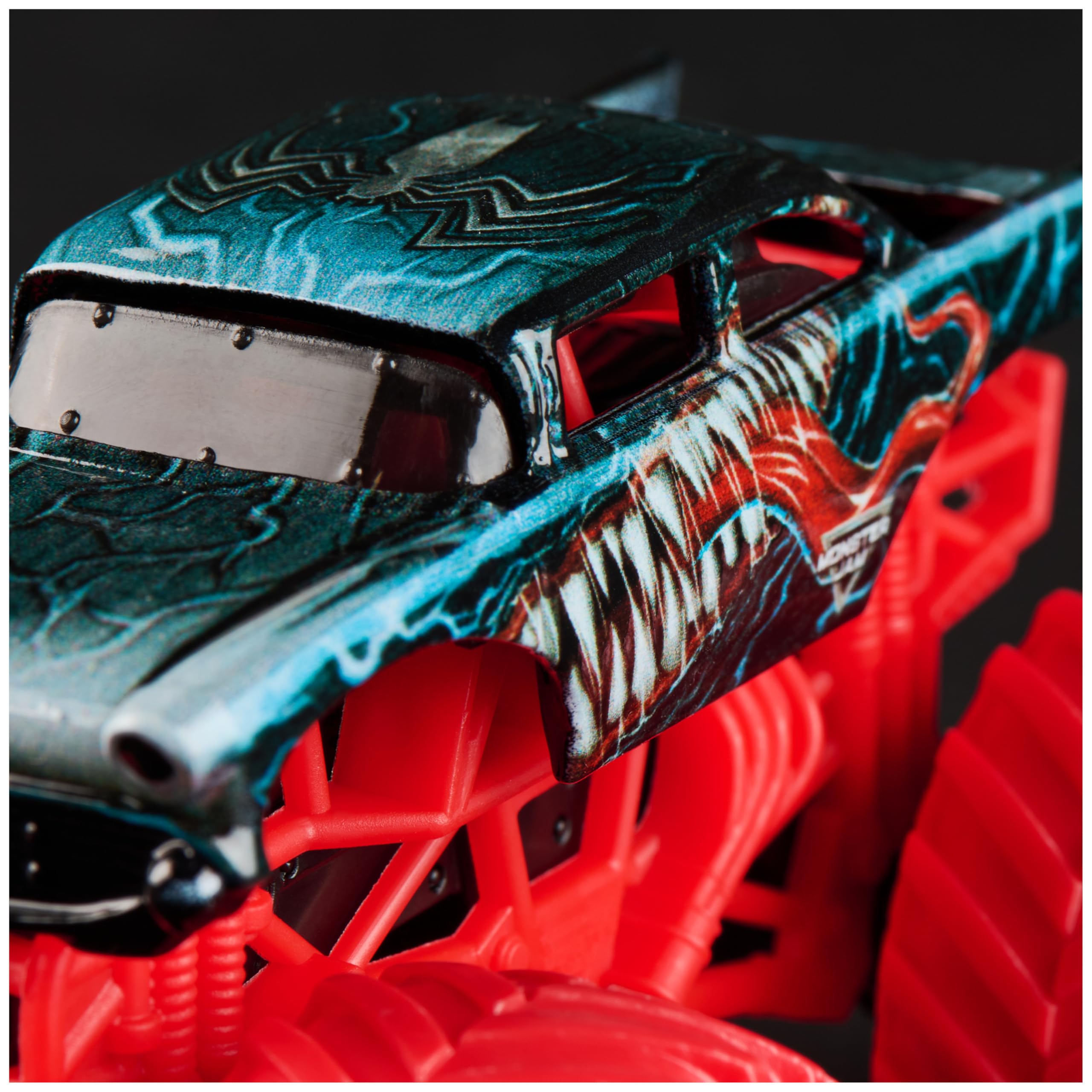 Monster Jam Marvel Venom truck tire detail adds realistic texture for authentic stunt setups.