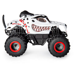 Monster Jam Monster Mutt Dalmatian RC truck in action performing donuts and big air.