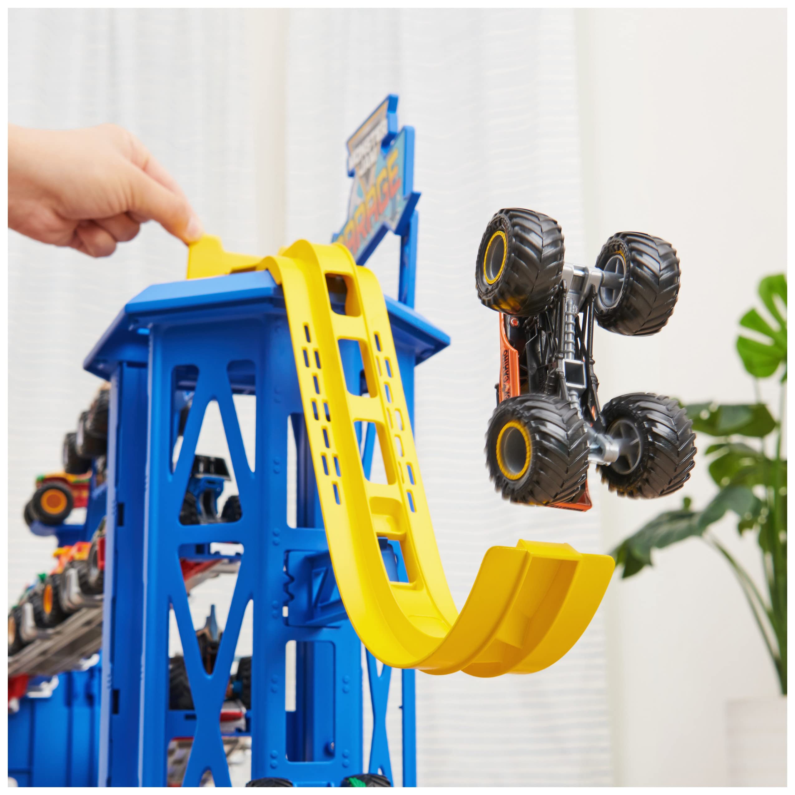 Monster Jam Garage stores 20+ trucks for organized, ready-to-play fleets