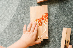 Montessori & Me first-letter sounds puzzle aids early literacy practice.