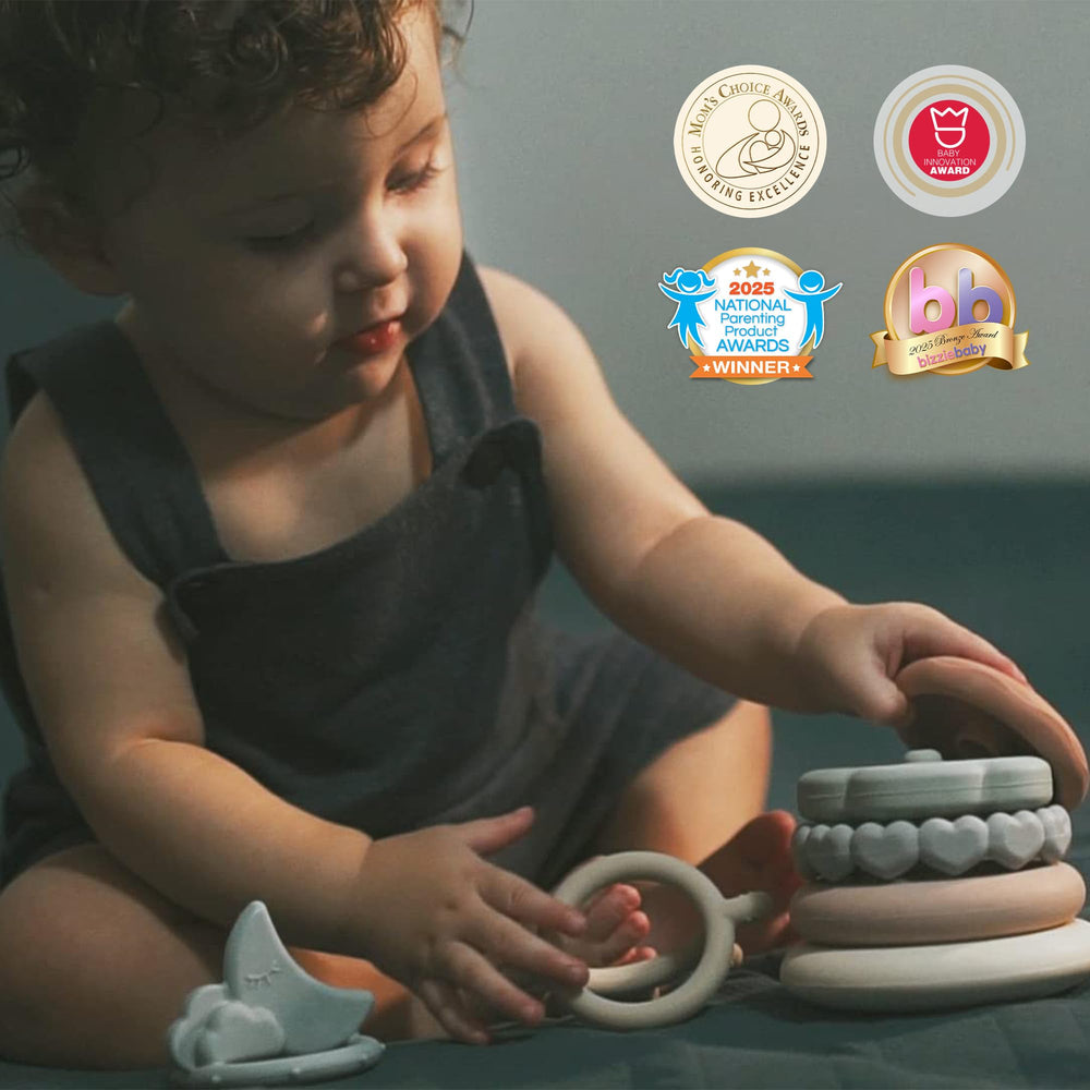 Moonkie Stacks of Circles baby rings on table; colorful shapes encourage sorting.