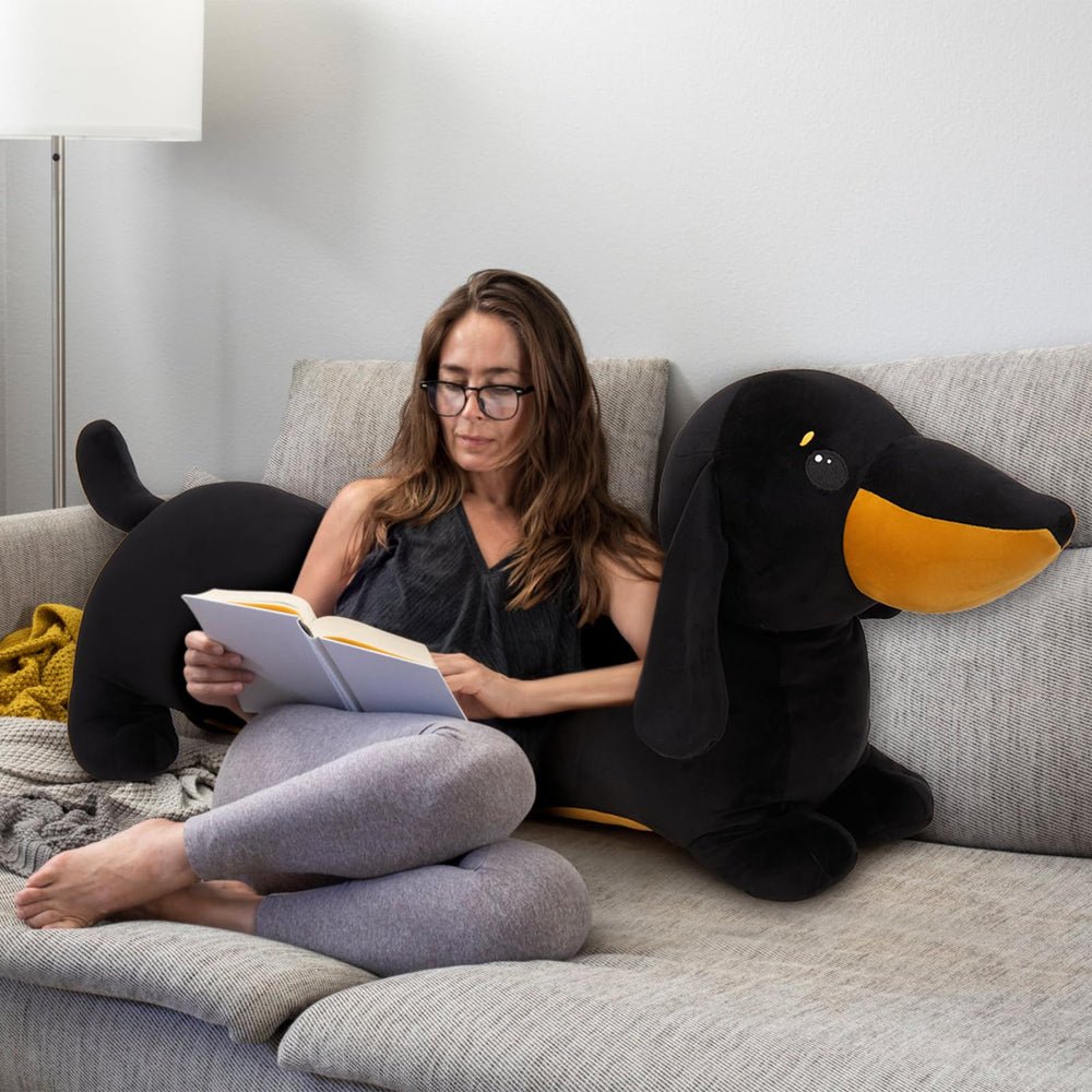 MorisMos dachshund pillow in bed creates a cozy reading buddy.