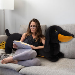 MorisMos dachshund pillow in bed creates a cozy reading buddy.