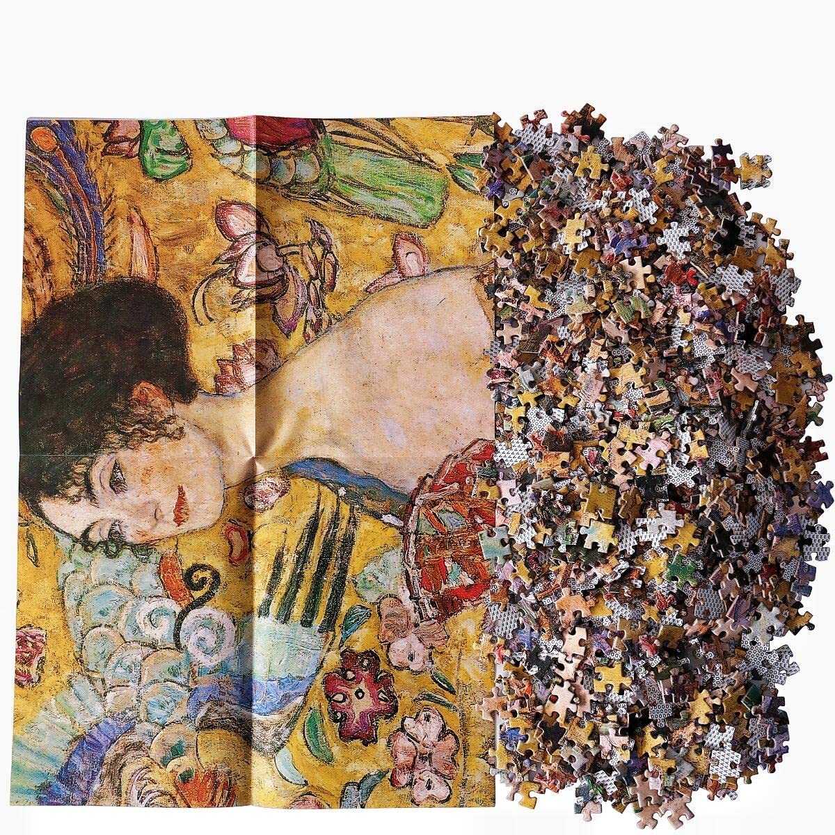 Moruska Lady with Fan puzzle pieces spread inviting collaborative and focused play.