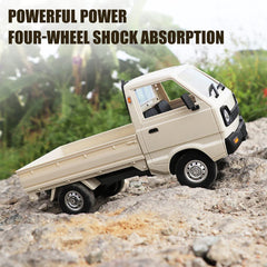 Mostop WPL D12 RC drift car with headlights on for enhanced realism.