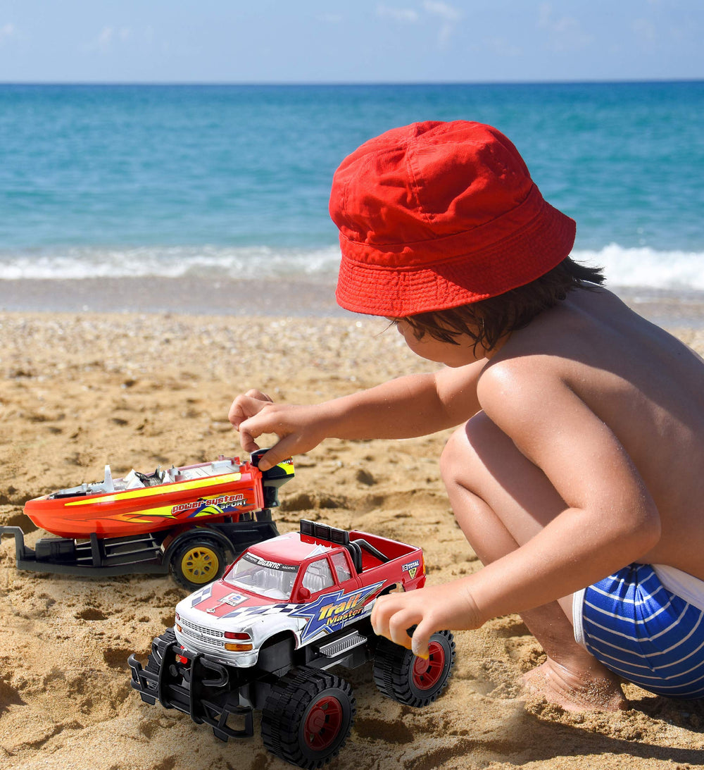 Mozlly beach-adventure setup invites shore-side imagining with truck and boat.