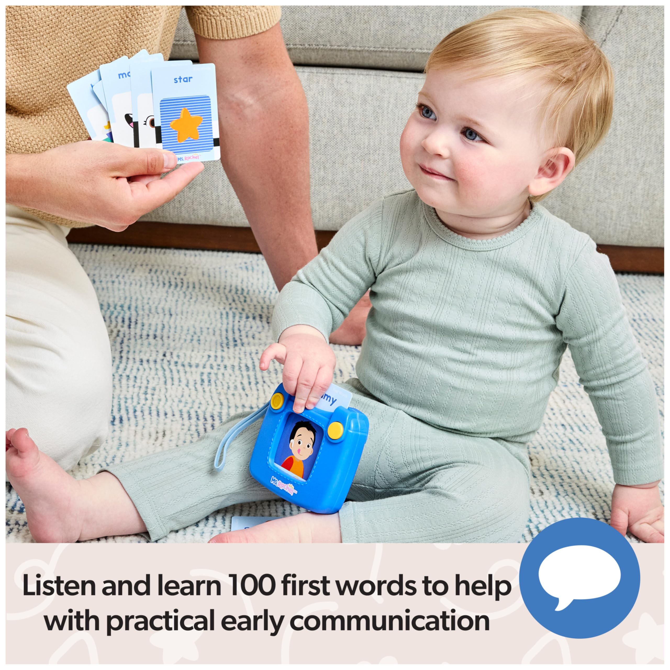 Toddler using Ms. Rachel reader with cards, promotes listening and word association