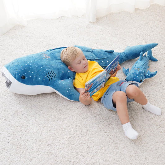 Mukouxun 39-inch whale shark plush sleeping pose ideal as a bedtime pillow.