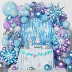 Murdizzo frozen balloon arch kit creates a winter wonderland backdrop.