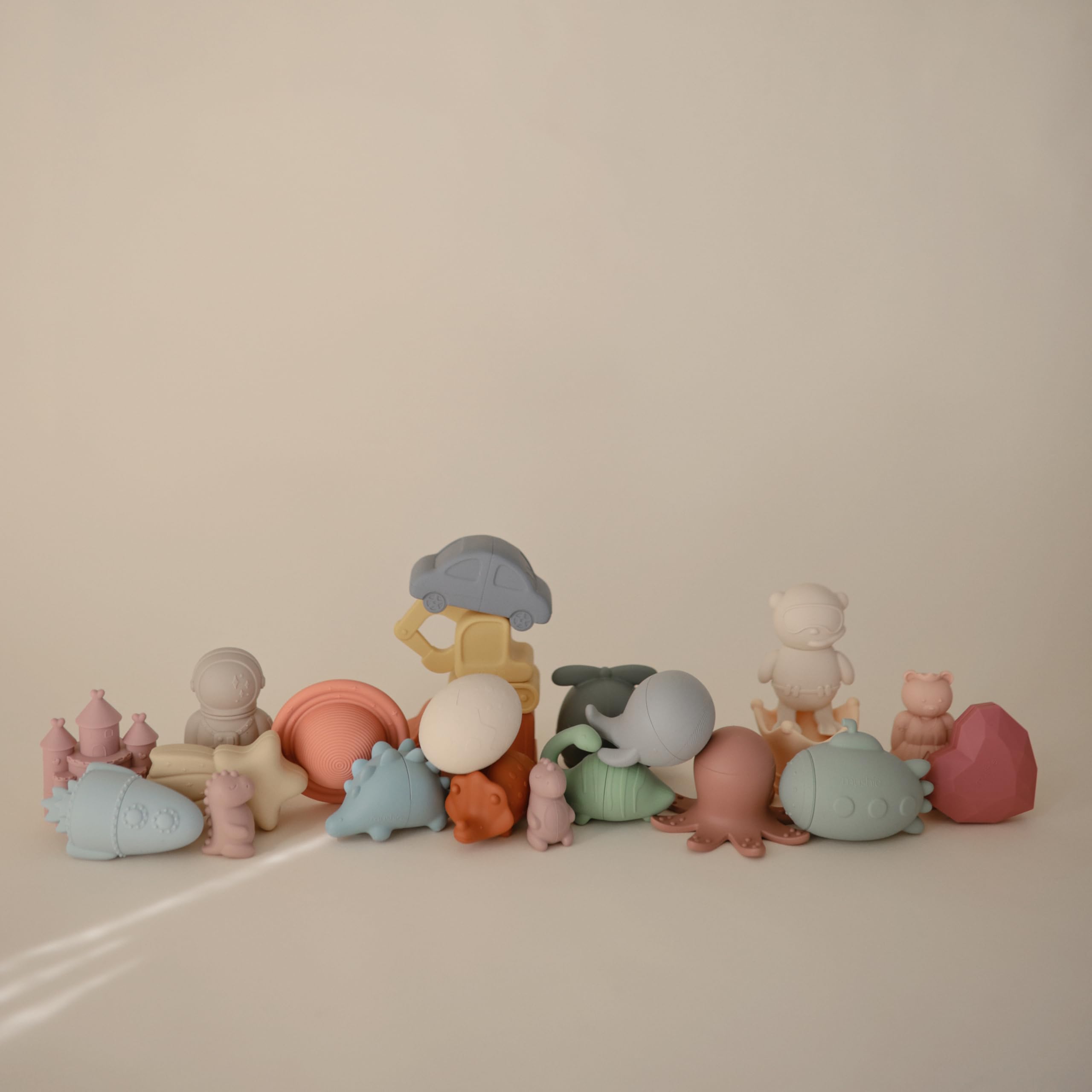 Mushie Dino Bath Toy opens into two pieces for easy cleaning.