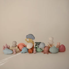 Mushie Dino Bath Toy opens into two pieces for easy cleaning.