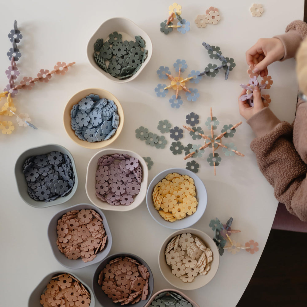 Mushie HEX Connect color mix discs spark visual interest and imaginative designs.