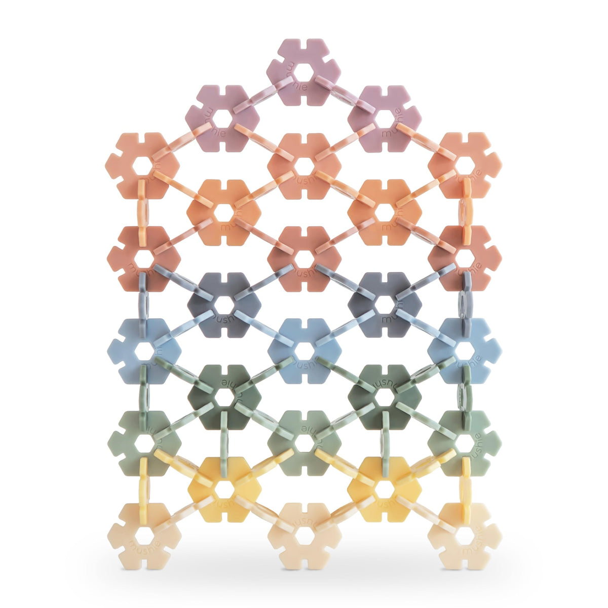 Mushie HEX Connect discs promote creative construction and spatial exploration.
