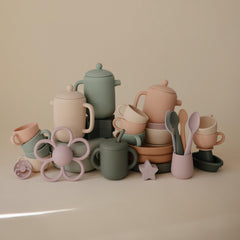 Mushie silicone tea set helps little ones explore meals and role play.