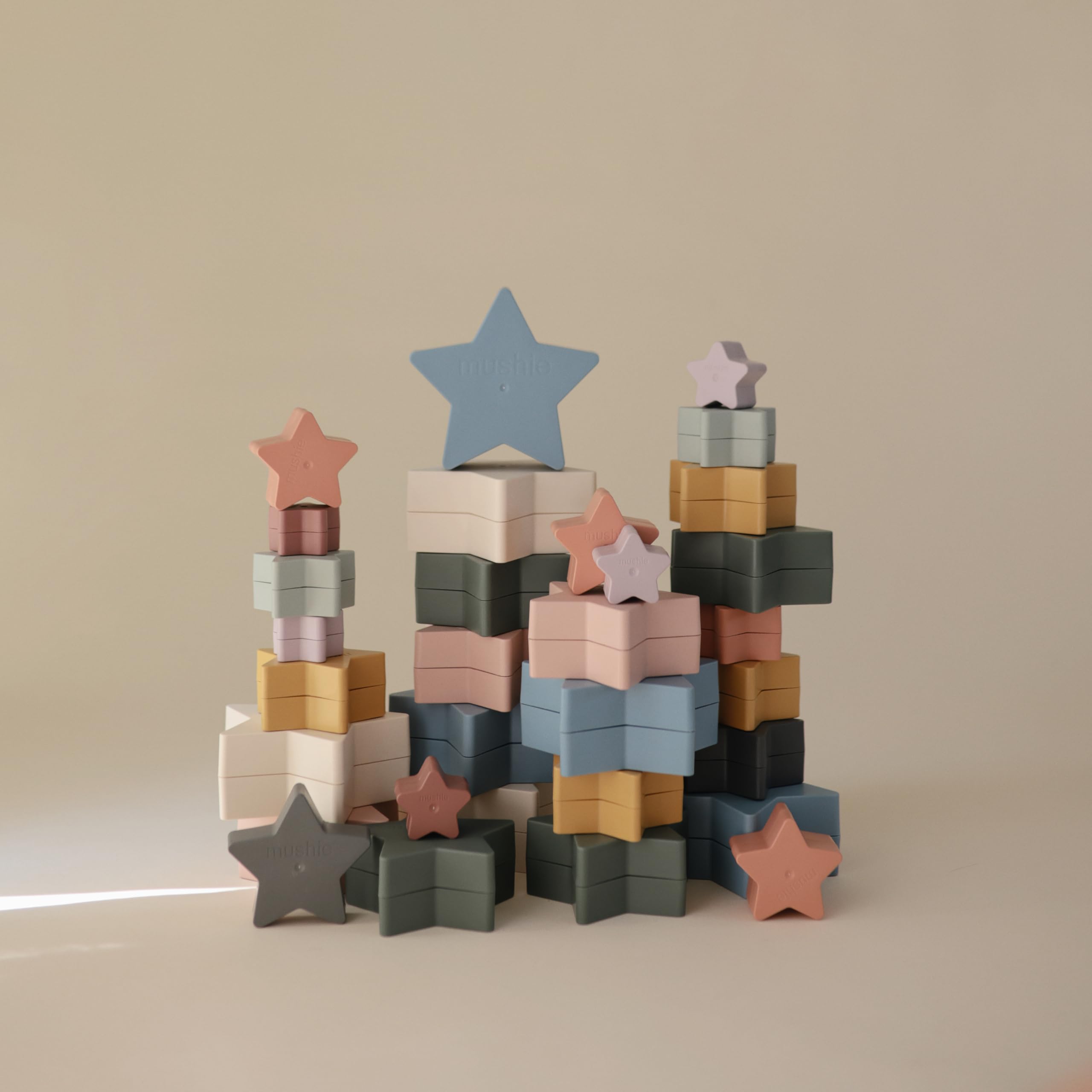 Mushie Nesting Stars demonstrating early motor skill development