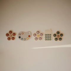 Mushie Paint Palette Press Toy recommended for babies 10+ months.