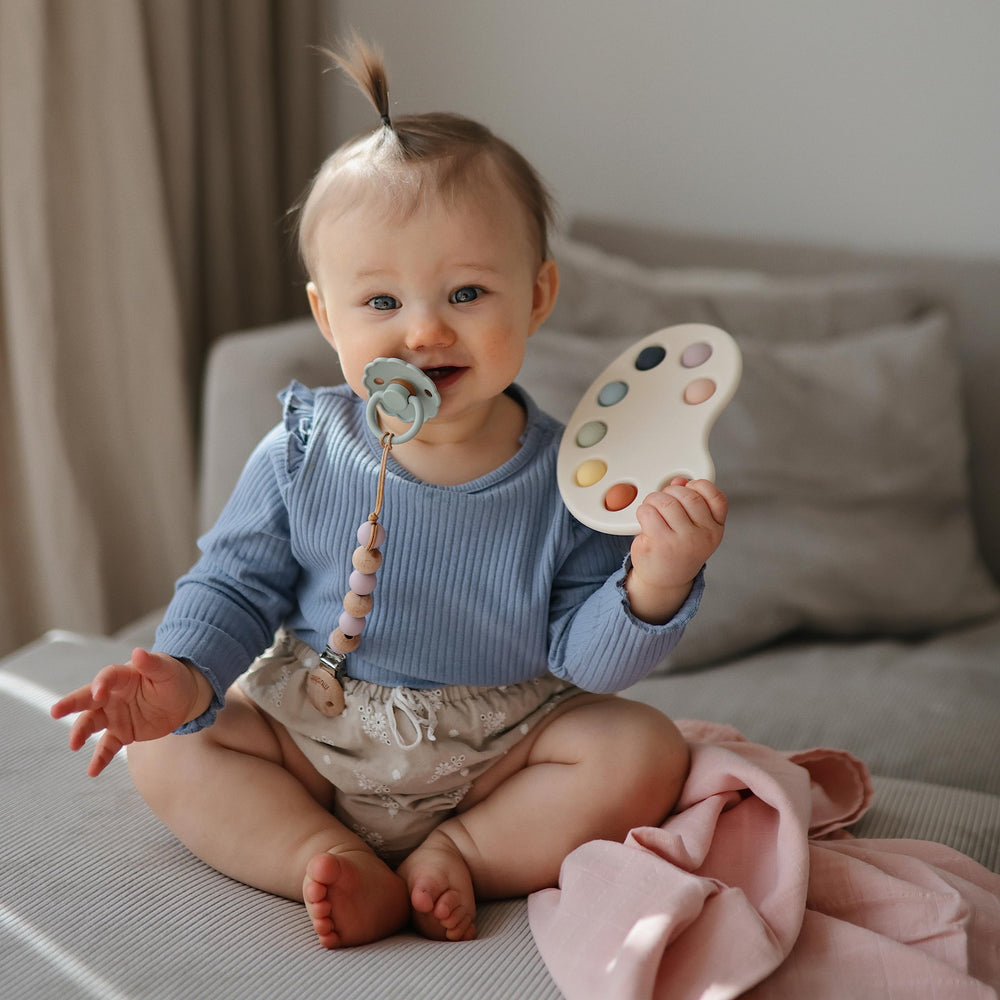 Mushie Paint Palette Press Toy uses 100% food-grade silicone for safety.