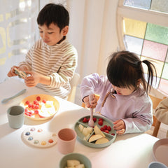Mushie silicone texture and calming colors on the Paint Palette Press Toy.