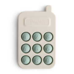 Mushie Phone Press Toy Cambridge Blue shows bubbles for sensory exploration.