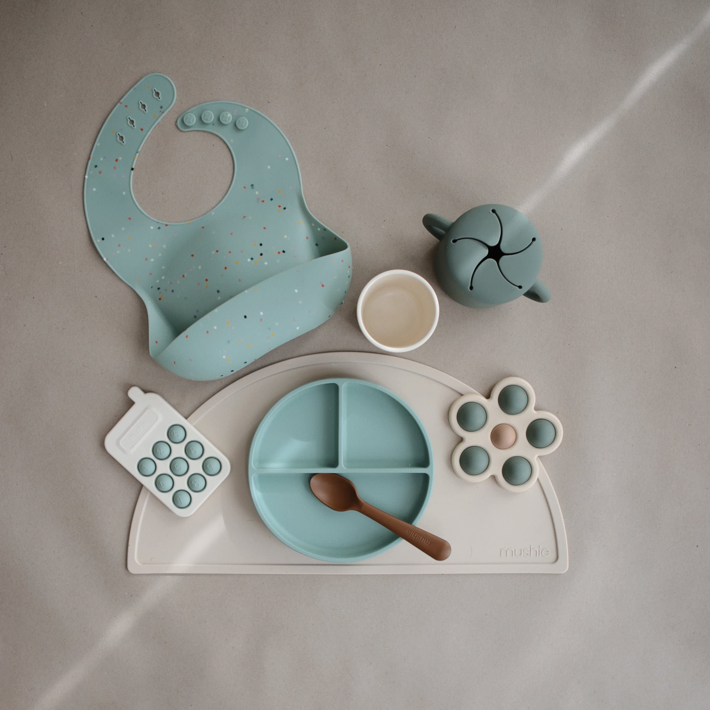 Mushie Phone Press Toy Cambridge Blue made with safe, BPA-free materials.