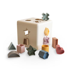 Mushie shape sorting box with 12 shapes for toddler learning and sensory play