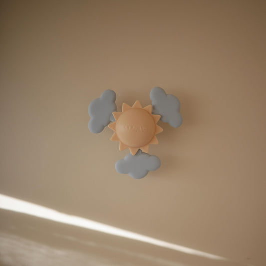 Mushie silicone clouds closeup showing soft textures and spin