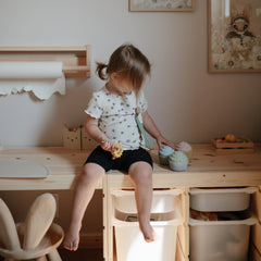 Mushie silicone cupcake toy close-up with smooth edges for gentle teething-inspired play