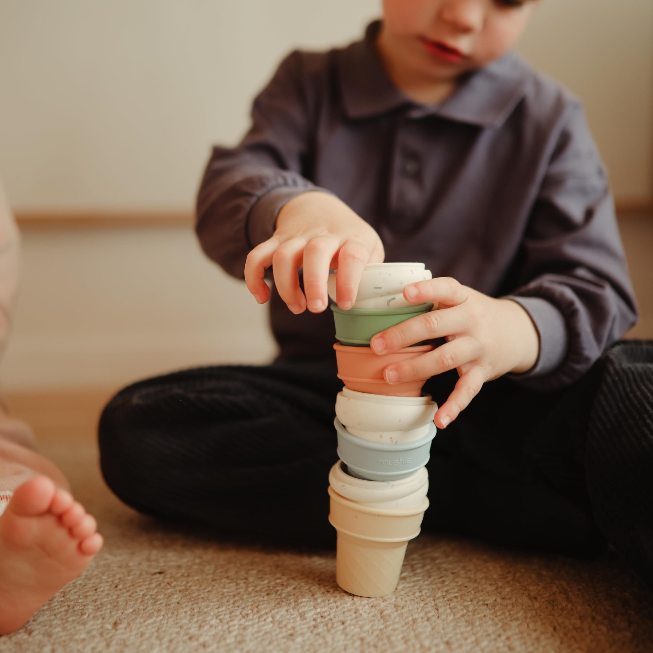 Mushie four-pack for bath time with splash-friendly silicone.