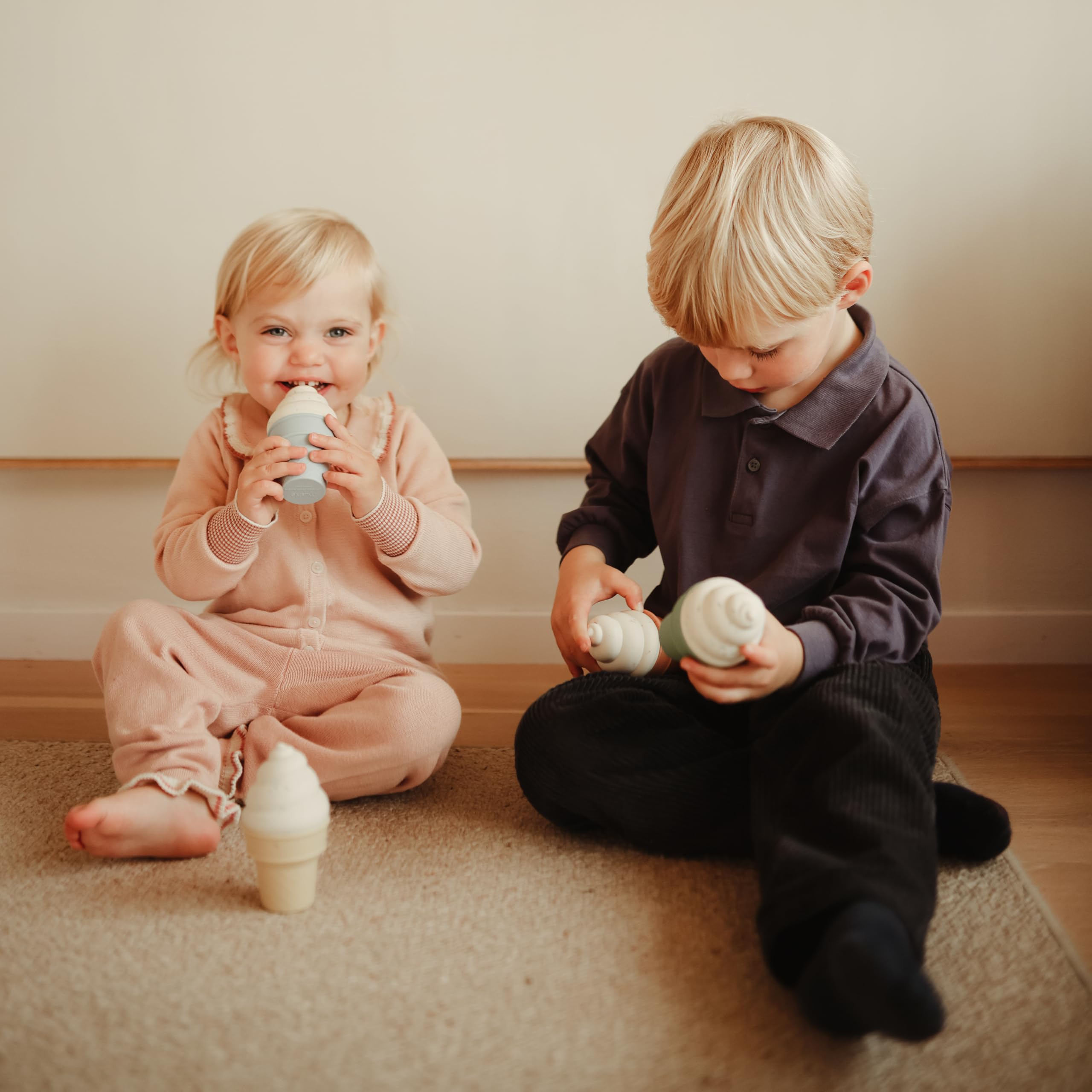 Handheld size Mushie ice cream figures for small grip practice.